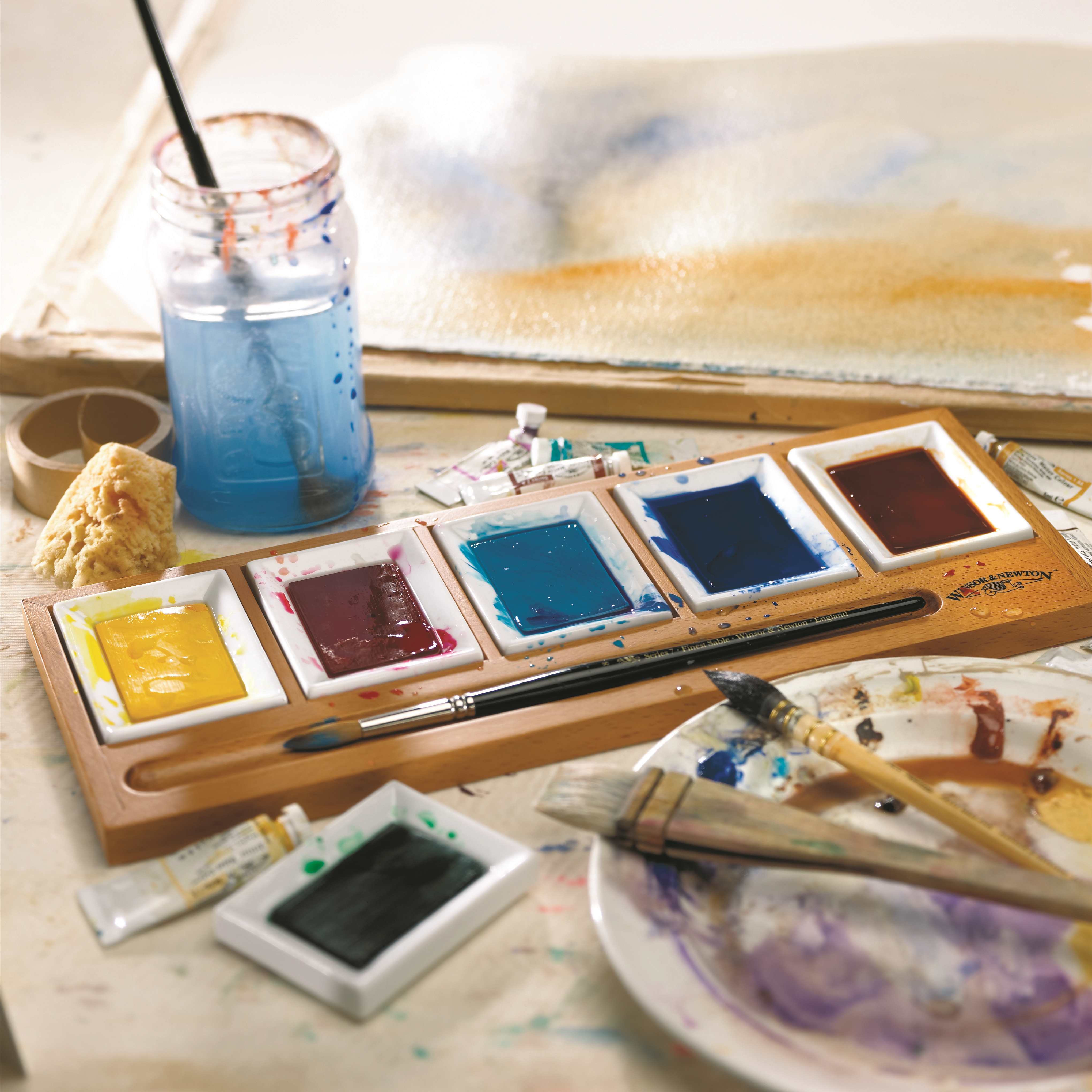 watercolour palette with brushes waterpot paint 